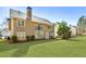 Expansive backyard with manicured lawn, patio, and view of the rear of the house at 173 Northshore Xing, Dallas, GA 30157