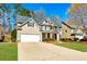 Charming two-story home featuring a two-car garage, well-maintained lawn, and inviting curb appeal at 173 Northshore Xing, Dallas, GA 30157