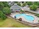 Aerial view of community pool area with lounge chairs and manicured landscaping at 173 Northshore Xing, Dallas, GA 30157