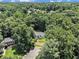 Aerial view of a home nestled in a lush, green neighborhood with mature trees at 186 Fernleaf Lane Ln, Marietta, GA 30068