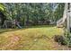 Spacious backyard with a swing set and a slide, ideal for children to play and enjoy outdoor activities at 186 Fernleaf Lane Ln, Marietta, GA 30068