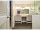 Bright bathroom features double sinks with white cabinetry and a walk-in shower at 186 Fernleaf Lane Ln, Marietta, GA 30068