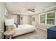 Charming bedroom with ceiling fan, natural light, and neutral color scheme at 186 Fernleaf Lane Ln, Marietta, GA 30068