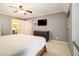 Bright bedroom features neutral walls and an ensuite bathroom with a wooden bed frame at 186 Fernleaf Lane Ln, Marietta, GA 30068
