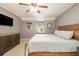 Bright bedroom features neutral walls, ceiling fan, window seat and wooden bed frame at 186 Fernleaf Lane Ln, Marietta, GA 30068