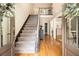 Grand foyer with hardwood floors, elegant staircase, and bright natural light at 186 Fernleaf Lane Ln, Marietta, GA 30068