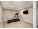 Finished exercise room with hardwood floors, recessed lighting, and television at 186 Fernleaf Lane Ln, Marietta, GA 30068
