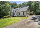 Attractive two-story home featuring a well-manicured lawn and a side-entry garage at 186 Fernleaf Lane Ln, Marietta, GA 30068