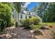 A charming two-story home surrounded by lush greenery and mature trees at 186 Fernleaf Lane Ln, Marietta, GA 30068