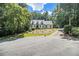 Charming two-story home with landscaped yard and mature trees on a sunny day at 186 Fernleaf Lane Ln, Marietta, GA 30068