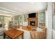 Spacious living room with a brick fireplace, hardwood floors, and plenty of natural light at 186 Fernleaf Lane Ln, Marietta, GA 30068