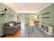 Inviting living room with hardwood floors, neutral walls, and natural light from the windows at 186 Fernleaf Lane Ln, Marietta, GA 30068