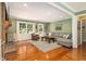 Cozy living room featuring hardwood floors, a brick fireplace, and ample seating at 186 Fernleaf Lane Ln, Marietta, GA 30068