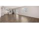 Open living space featuring a modern kitchen, and hard wood flooring at 1900 Van Allen Ct, Dacula, GA 30019