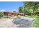A house featuring a patio, large parking area, swing set, and well-maintained lawn at 2247 Cypress Ave, Morrow, GA 30260