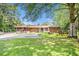 Expansive backyard featuring ample parking, seating, playset, and wooded backdrop, perfect for outdoor gatherings at 2247 Cypress Ave, Morrow, GA 30260