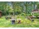 Spacious backyard with various seating options and playground equipment, perfect for outdoor entertaining at 2247 Cypress Ave, Morrow, GA 30260