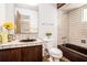 A full bathroom with tile throughout, a single vanity, and a built-in shower at 2247 Cypress Ave, Morrow, GA 30260