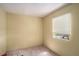 Cozy bedroom featuring light-colored walls and a window providing natural light at 2247 Cypress Ave, Morrow, GA 30260