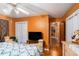 The bedroom has hardwood floors, closet space, and provides a walk-through to a separate walk-in closet at 2247 Cypress Ave, Morrow, GA 30260