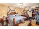 A bedroom features a queen bed, matching furnishings, hardwood floors, and plenty of space for storage at 2247 Cypress Ave, Morrow, GA 30260