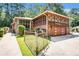 Mid-century modern home with red brick, a screened-in porch, and a well-maintained front yard at 2247 Cypress Ave, Morrow, GA 30260