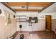 Unfinished garage space with shelves and overhead door mechanism at 2247 Cypress Ave, Morrow, GA 30260