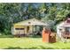Quaint guest house with covered porch and brick barbecue at 2247 Cypress Ave, Morrow, GA 30260