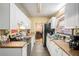 Functional kitchen with white cabinets and stainless steel appliances at 2247 Cypress Ave, Morrow, GA 30260