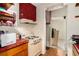 Functional kitchen featuring a stove, microwave, and classic tile at 2247 Cypress Ave, Morrow, GA 30260