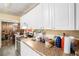 Functional kitchen with white cabinets and stainless steel appliances at 2247 Cypress Ave, Morrow, GA 30260