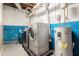 Basement laundry room with washer, dryer, and water heater at 2247 Cypress Ave, Morrow, GA 30260