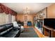 Inviting living room with a fireplace, chandelier, and comfortable seating at 2247 Cypress Ave, Morrow, GA 30260