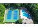 Community pool and tennis courts surrounded by lush trees at 2423 Walnut Tree Ln, Buford, GA 30519