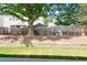 View of the backyard with a wood fence, shed, and gazebo at 2423 Walnut Tree Ln, Buford, GA 30519