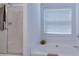 Bright bathroom featuring a soaking tub, a separate shower and a window, ideal for relaxation at 2423 Walnut Tree Ln, Buford, GA 30519