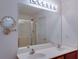 Bathroom featuring a double sink vanity with a shower visible in the mirror at 2423 Walnut Tree Ln, Buford, GA 30519