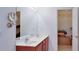 Bathroom featuring a double sink vanity and a large mirror, complemented by ample closet space at 2423 Walnut Tree Ln, Buford, GA 30519