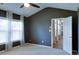 Bedroom with carpet flooring, a ceiling fan and natural light from windows with curtains at 2423 Walnut Tree Ln, Buford, GA 30519