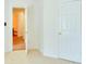 Bedroom featuring carpet flooring, two doors and a bathroom view at 2423 Walnut Tree Ln, Buford, GA 30519