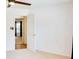 Bedroom with carpet flooring, a ceiling fan, and two doors at 2423 Walnut Tree Ln, Buford, GA 30519
