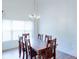 Bright dining room with natural light and a classic chandelier at 2423 Walnut Tree Ln, Buford, GA 30519