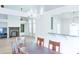 Open-concept dining room overlooking living room, lots of natural light at 2423 Walnut Tree Ln, Buford, GA 30519