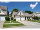 Charming single Gathering home with a well-manicured lawn and a two-car garage at 2423 Walnut Tree Ln, Buford, GA 30519