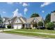 Charming single Gathering home with a well-manicured lawn and a two-car garage at 2423 Walnut Tree Ln, Buford, GA 30519