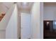 Hallway featuring stairs to a second floor and a doorway, providing seamless transition between spaces at 2423 Walnut Tree Ln, Buford, GA 30519