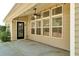 View of the porch with exterior lights and a ceiling fan at 2423 Walnut Tree Ln, Buford, GA 30519