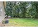Expansive backyard with lush greenery and shade trees provides a private outdoor space at 60 Newton Ridge Dr, Covington, GA 30014