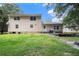Spacious backyard with green lawn and mature trees offers plenty of room for outdoor activities at 60 Newton Ridge Dr, Covington, GA 30014