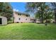 Large backyard with green grass and mature trees at 60 Newton Ridge Dr, Covington, GA 30014